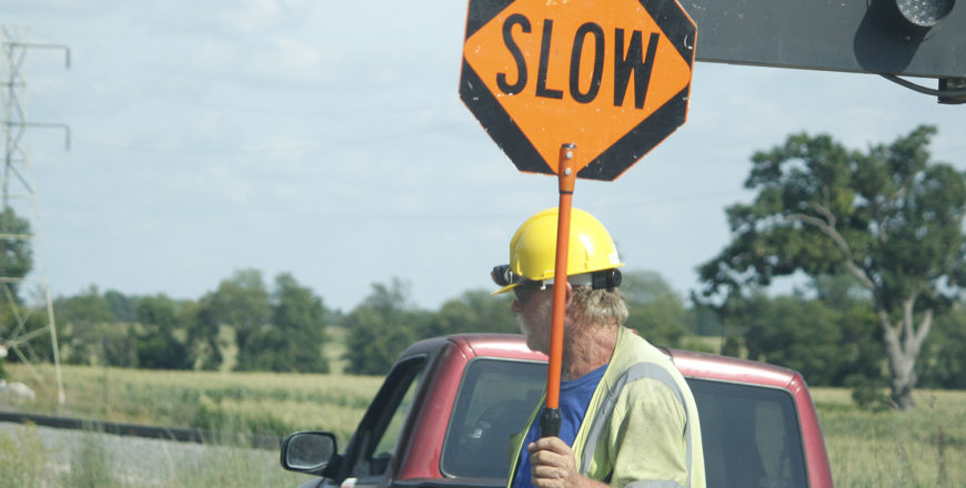 The Ontario Traffic Manual Book 7 course instructs construction worker on the proper attire and safety gear required while operating as the traffic control person at a construction zone.