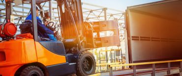 Forklift loading cargo safely.